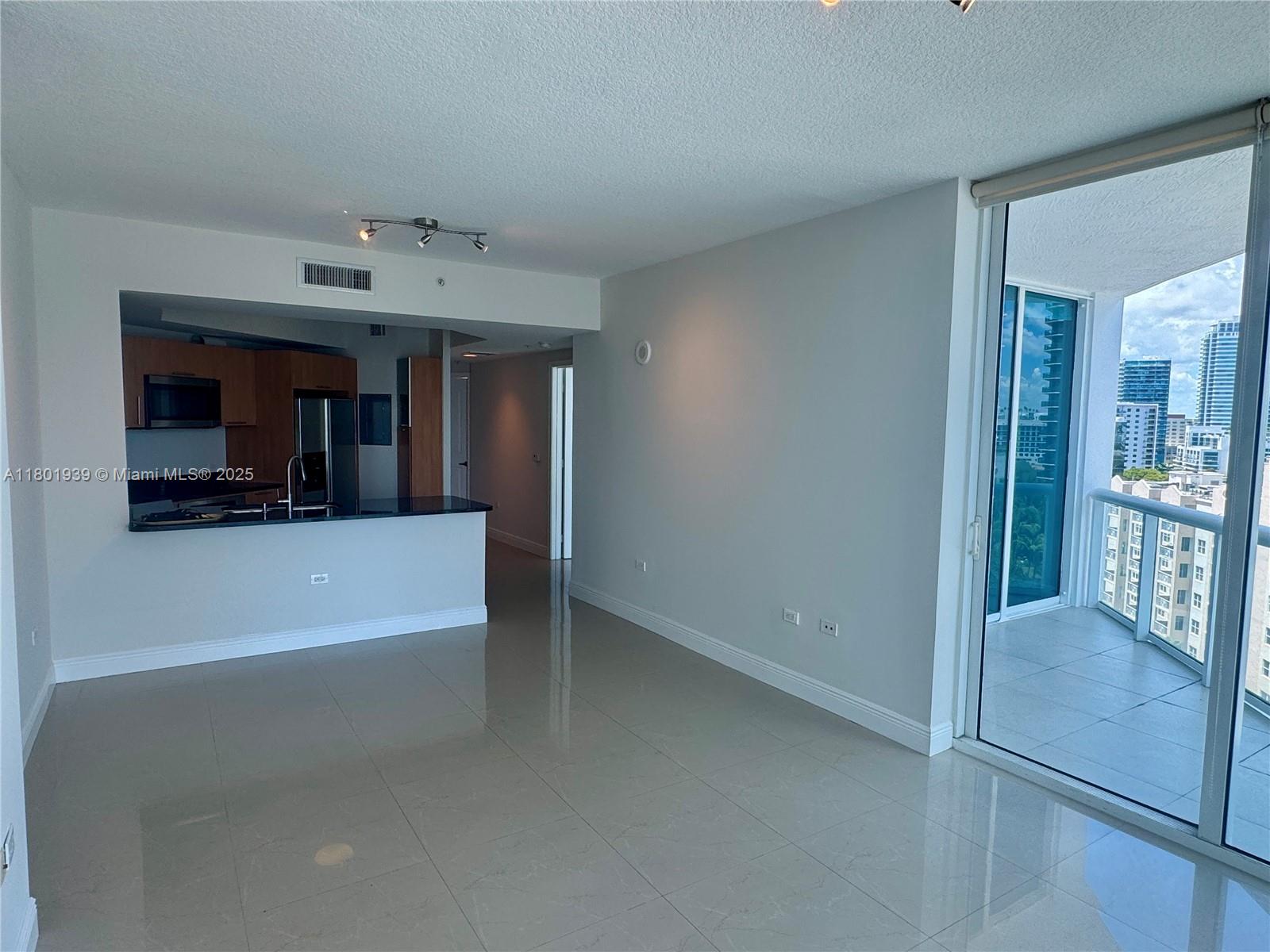 Edgewater Miami, FL 33137 - Photo 6 of 31 a view of a living room and bathroom