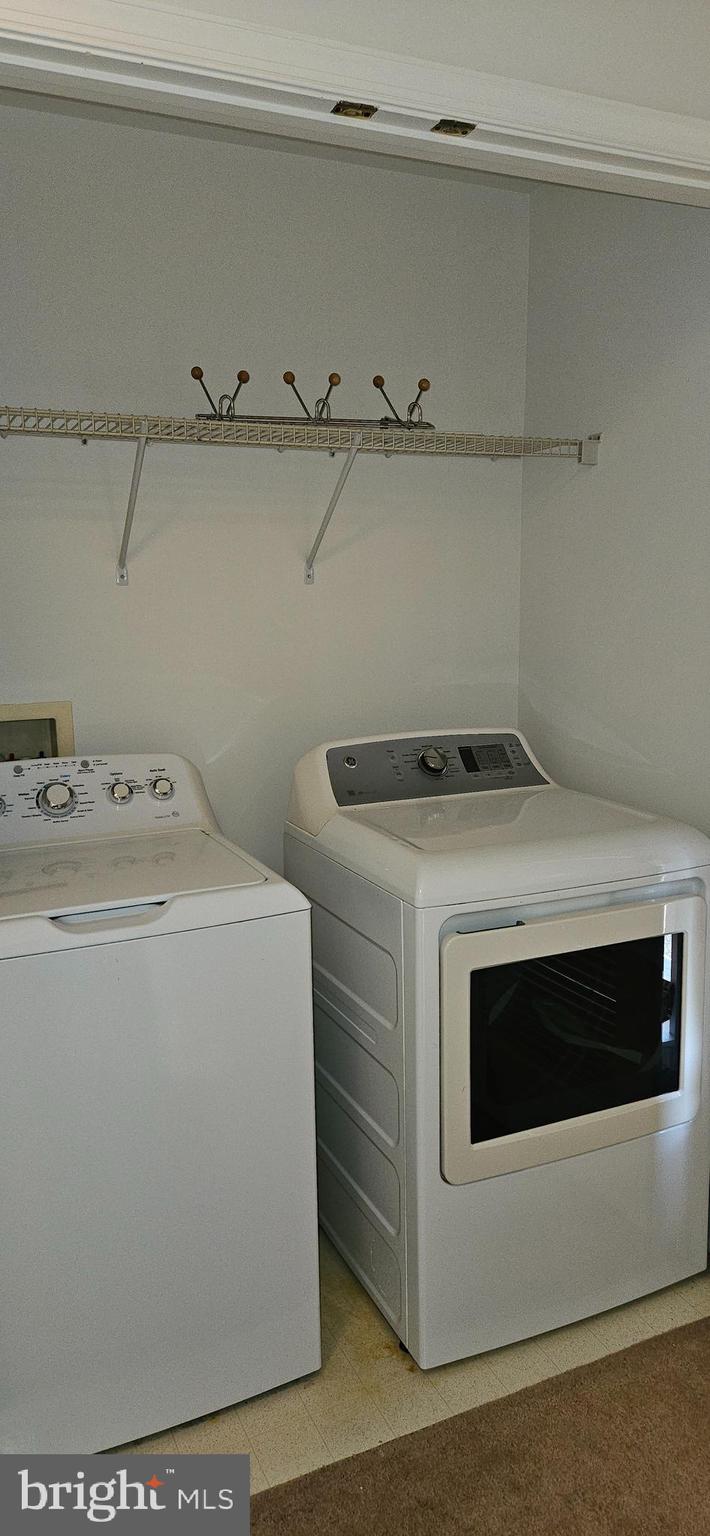 12332 Rollys Ridge Avenue, Unit 2105 Upper Marlboro, MD 20774 - Photo 16 of 31 a utility room with dryer and washer