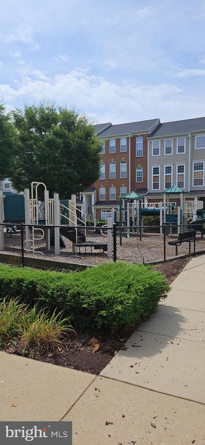 12332 Rollys Ridge Avenue, Unit 2105 Upper Marlboro, MD 20774 - Photo 31 of 31 a view of a building with a garden