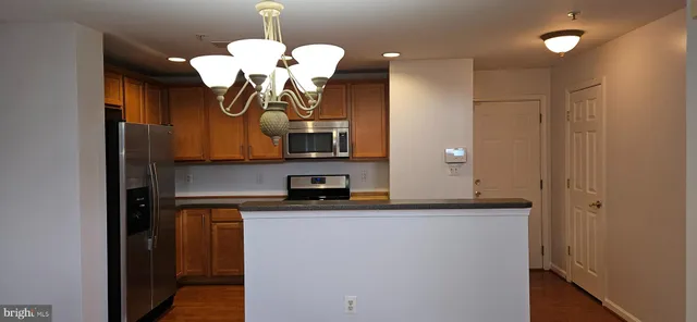 a room with a sink and chandelier