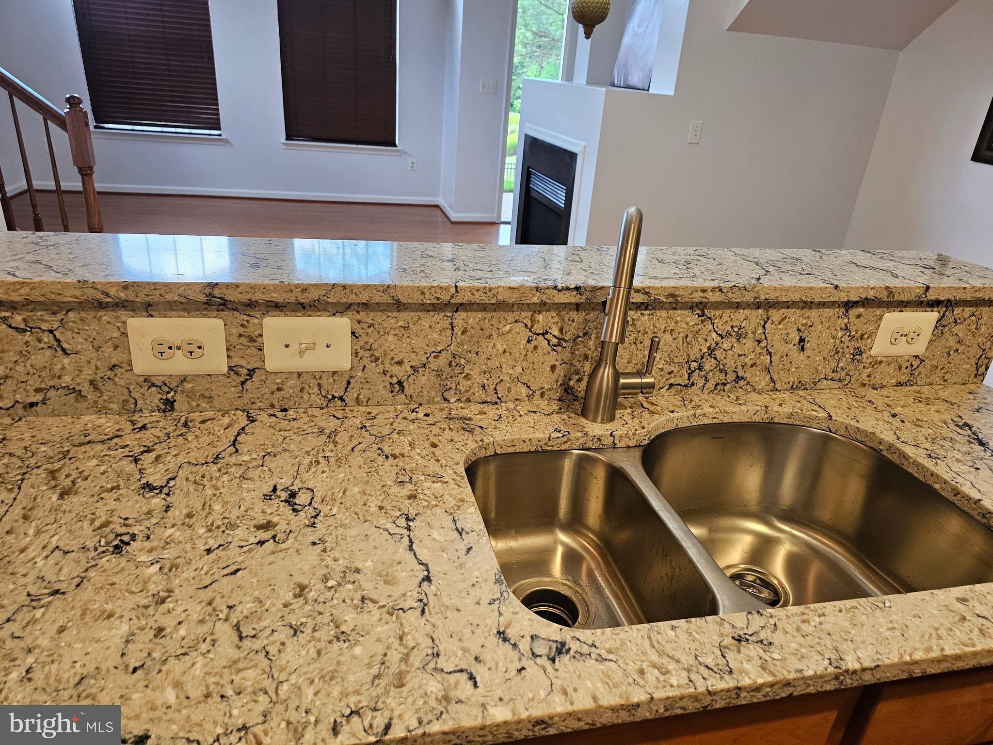 12332 Rollys Ridge Avenue, Unit 2105 Upper Marlboro, MD 20774 - Photo 6 of 31 a kitchen with a sink and granite top
