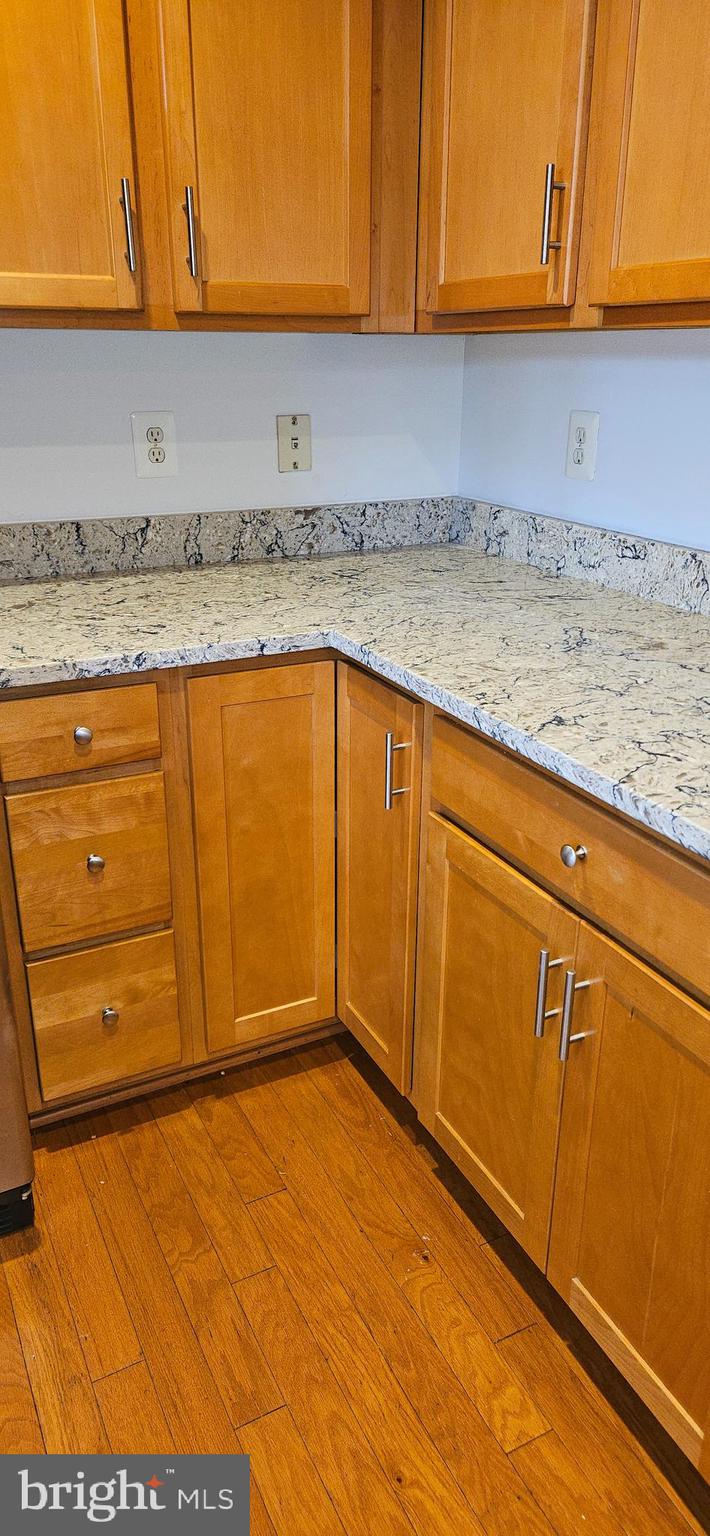 12332 Rollys Ridge Avenue, Unit 2105 Upper Marlboro, MD 20774 - Photo 8 of 31 a view of a kitchen with an empty space and a window