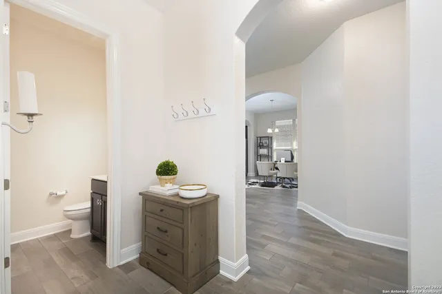 a bathroom with a sink toilet and mirror