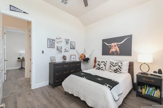 a bedroom with a bed and a dresser