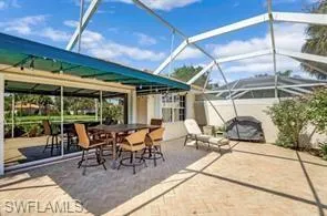 a view of a patio with a dining table and chairs