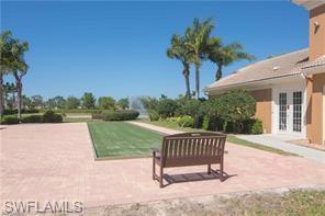 3687 El Segundo Court Naples, FL 34109 - Photo 16 of 17 a view of a house with backyard and a garden