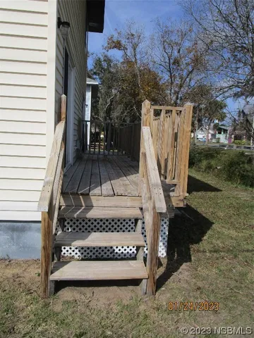 a view of stairs with wooden fence
