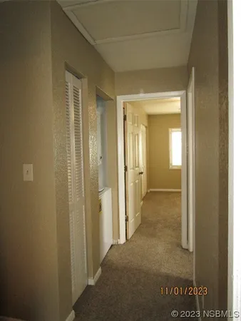 a view of a bathroom from a hallway