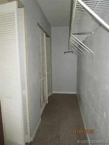 a view of hallway with stairs