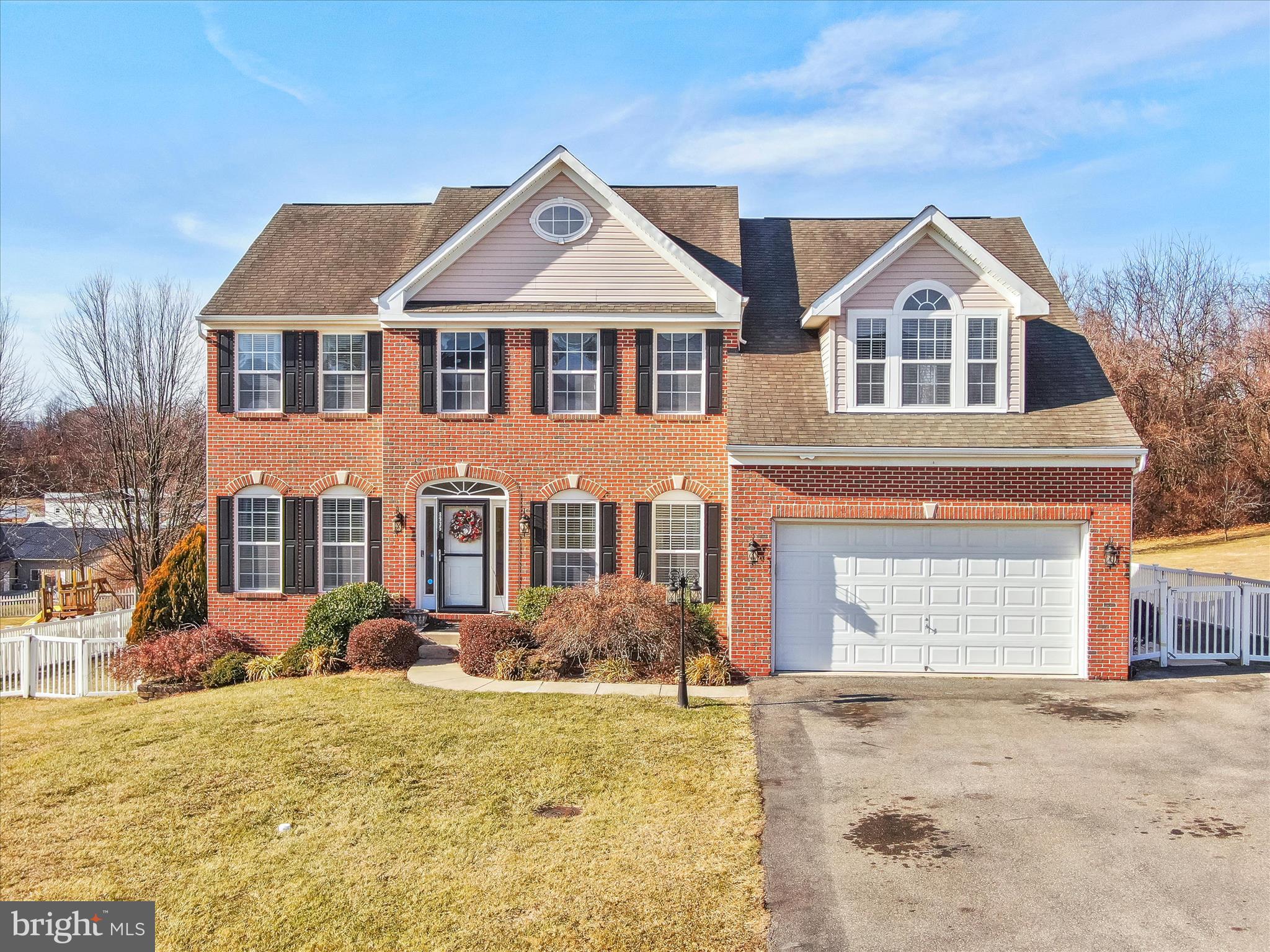 8935 Harper Drive Waynesboro, PA 17268 - Photo 1 of 46 a front view of a house with a yard and garage