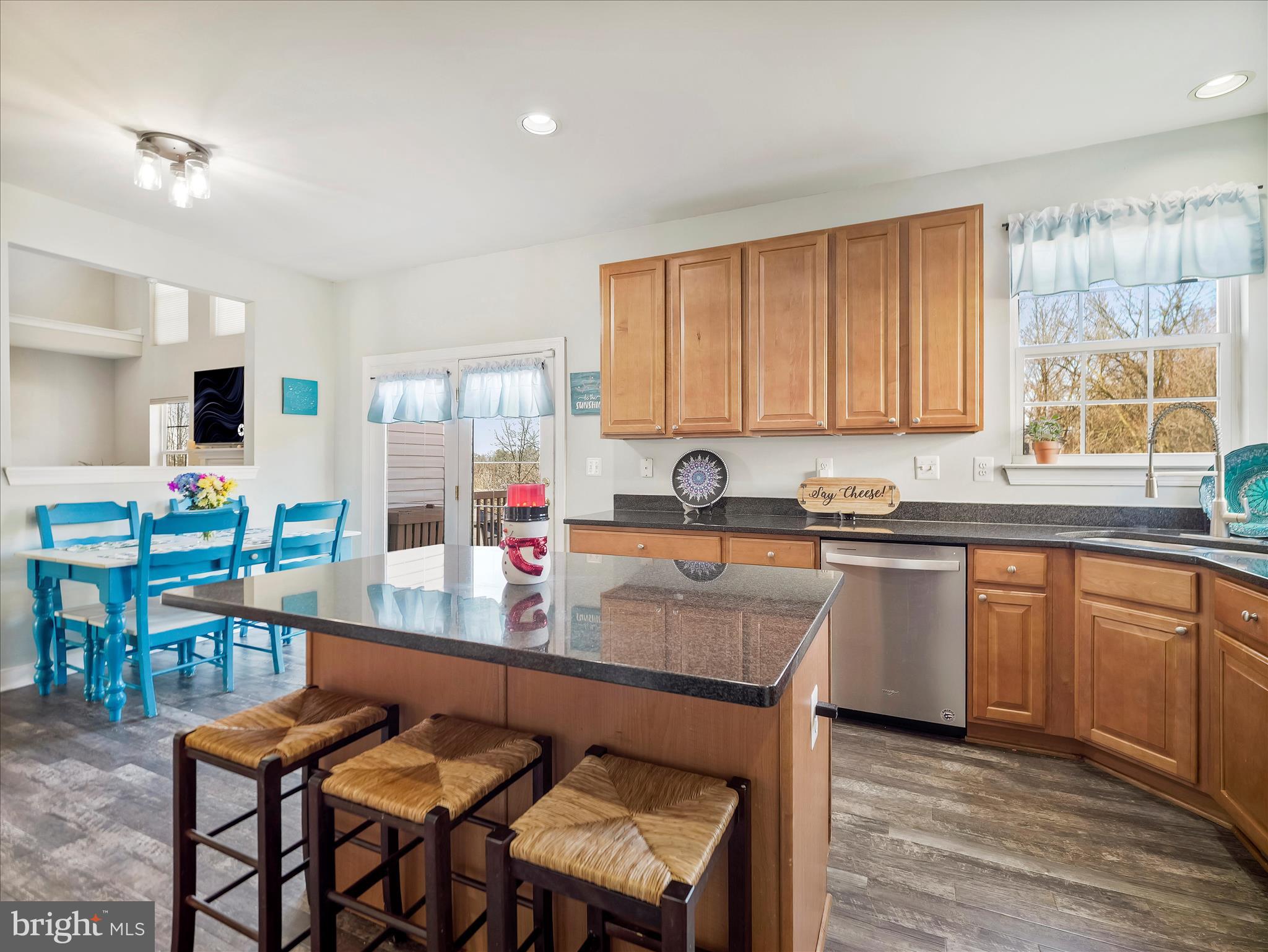 8935 Harper Drive Waynesboro, PA 17268 - Photo 13 of 46 a kitchen with stainless steel appliances granite countertop a stove top oven a sink dishwasher and cabinets with wooden floor