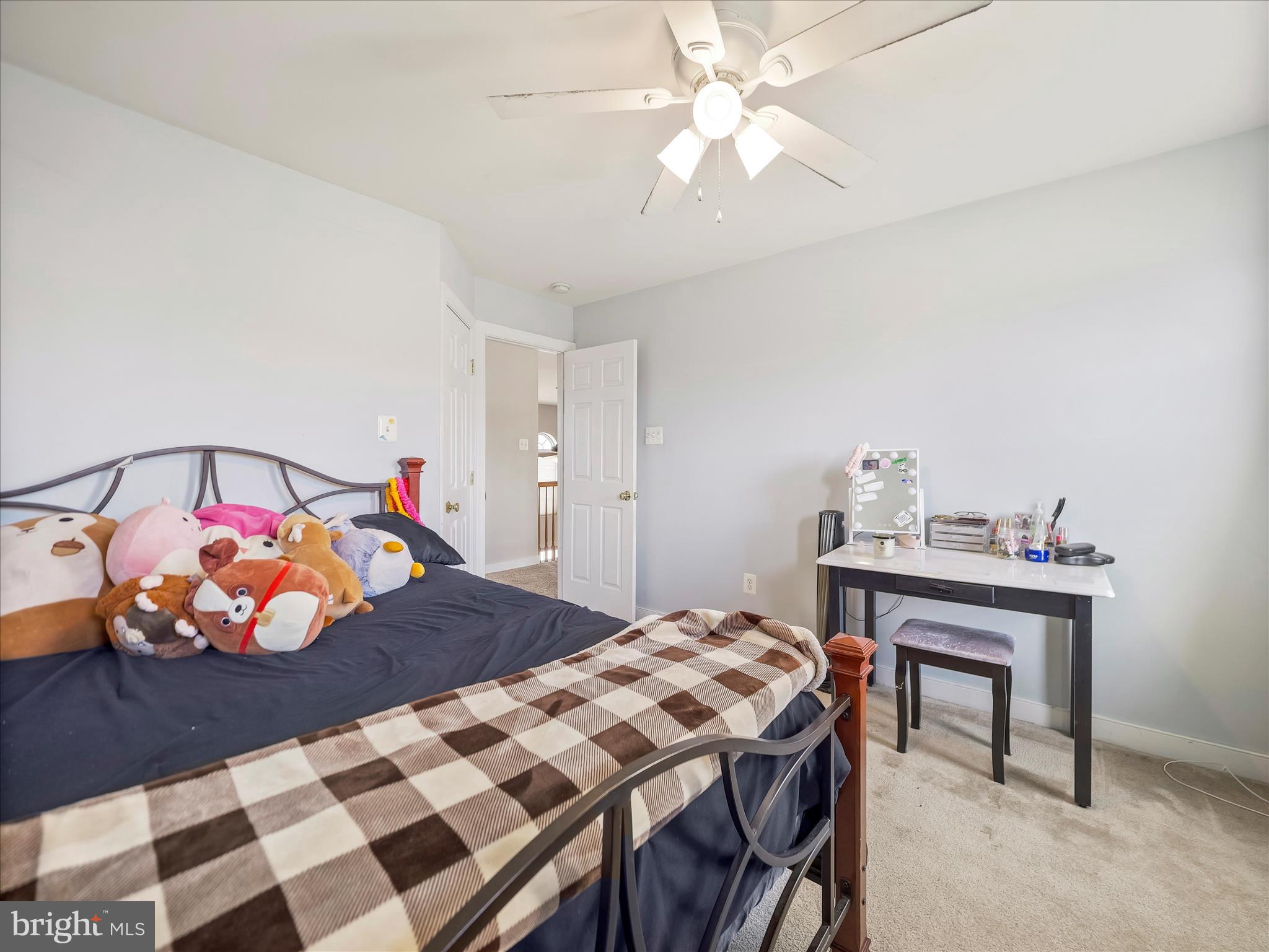 8935 Harper Drive Waynesboro, PA 17268 - Photo 31 of 46 a bedroom with a bed and a chandelier