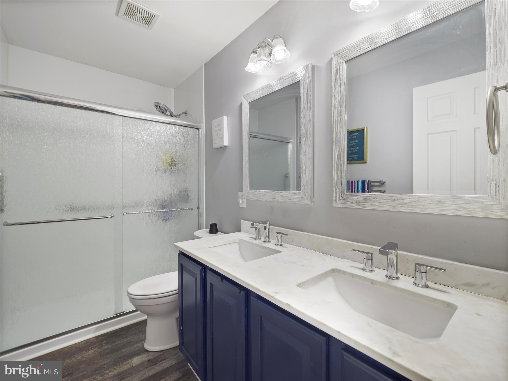 8935 Harper Drive Waynesboro, PA 17268 - Photo 32 of 46 a bathroom with a sink toilet double vanity and shower