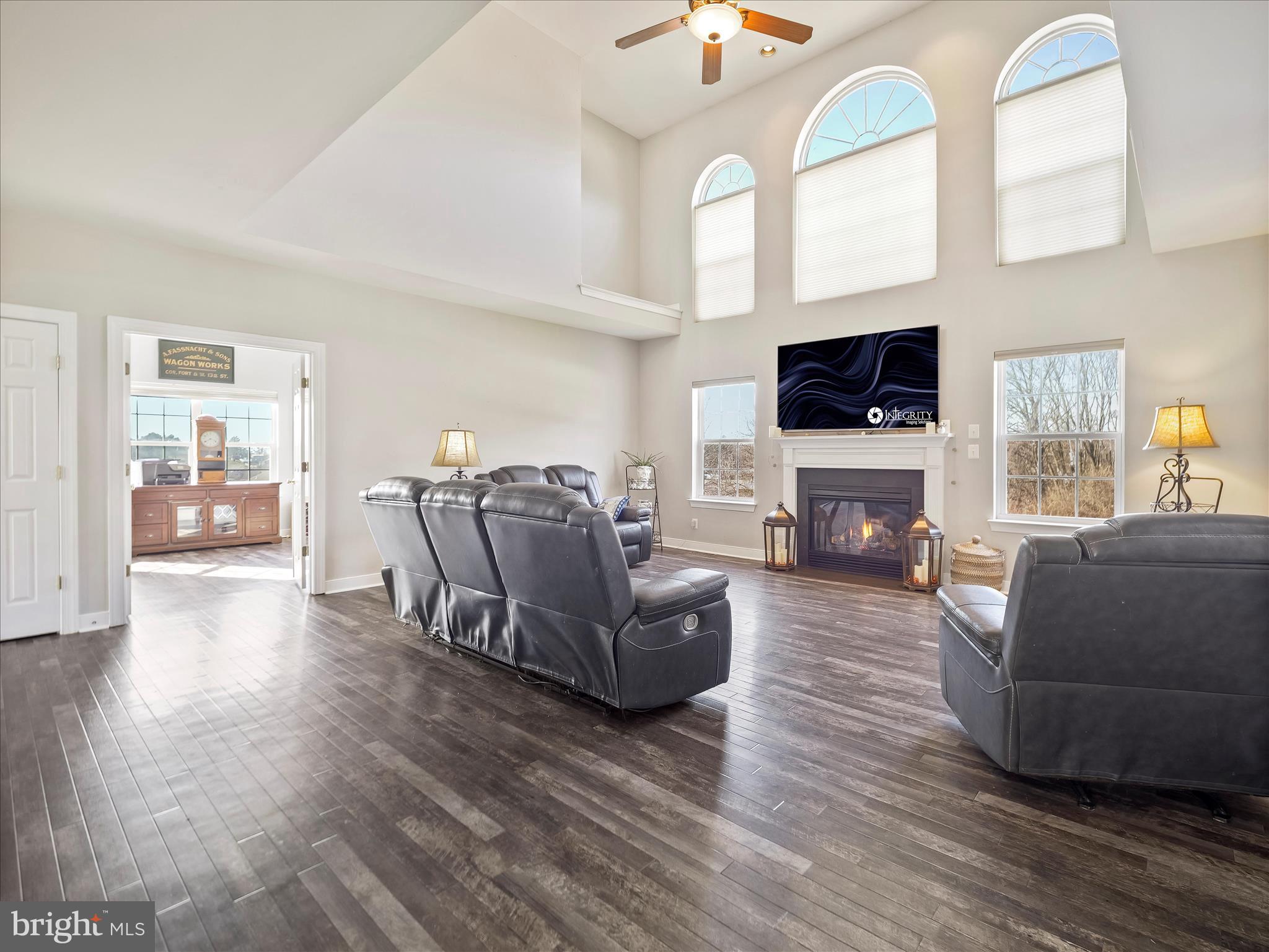 8935 Harper Drive Waynesboro, PA 17268 - Photo 8 of 46 a living room with furniture a flat screen tv and a fireplace