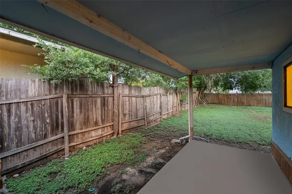 a view of a backyard with green space