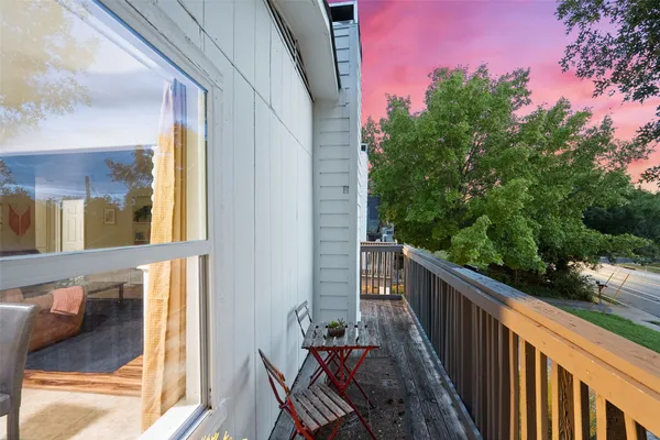 a view of balcony with furniture