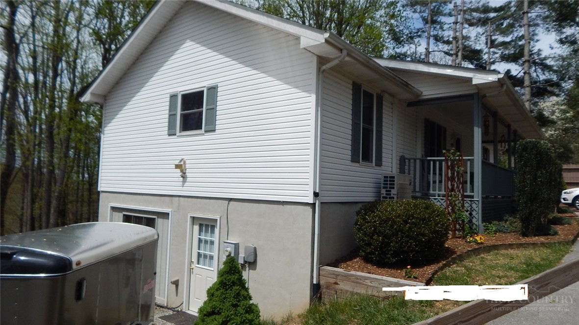 190 Kings Road Boone, NC 28607 - Photo 4 of 15 a front view of a house with garden
