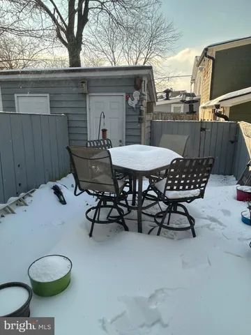 a view of a chairs and table in patio