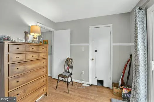 a view of a dresser with mirror and furniture