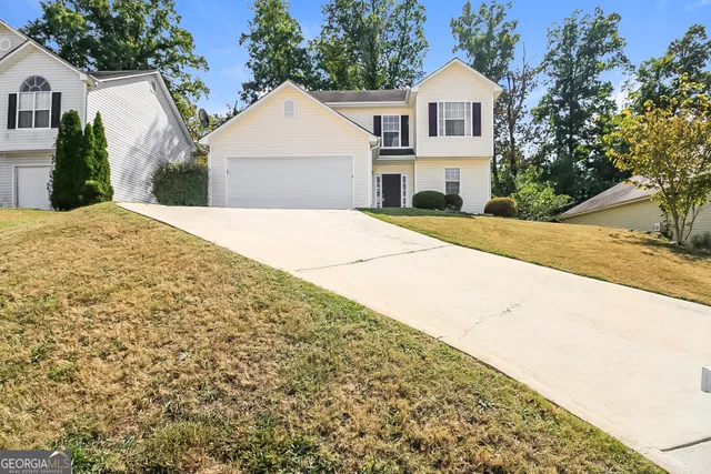 a house view with a garden space