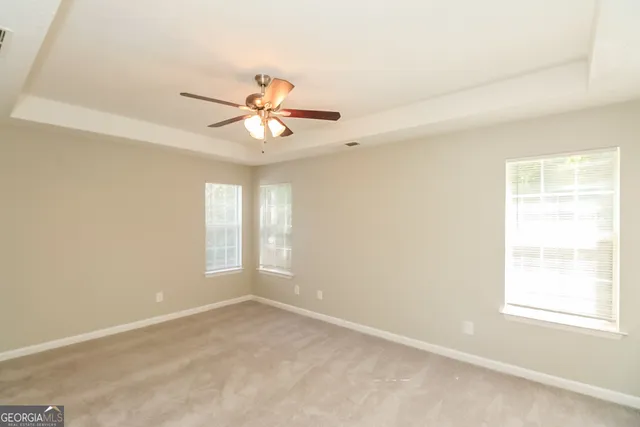a view of an empty room and window