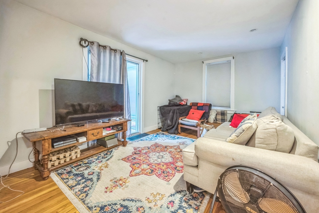 67 Meadow Street Framingham, MA 01701 - Photo 13 of 15 a living room with furniture and a flat screen tv