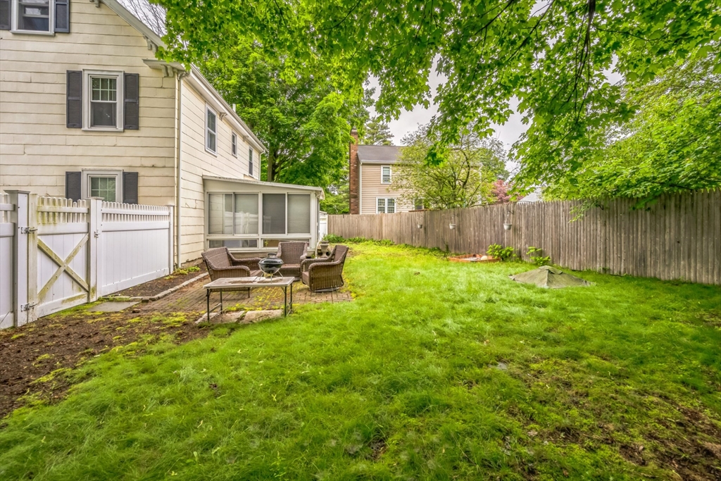 67 Meadow Street Framingham, MA 01701 - Photo 15 of 15 a backyard of a house with table and chairs