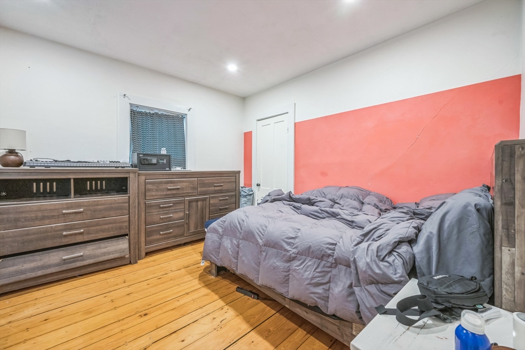 67 Meadow Street Framingham, MA 01701 - Photo 6 of 15 a bed sitting in a bedroom next to a window and dresser