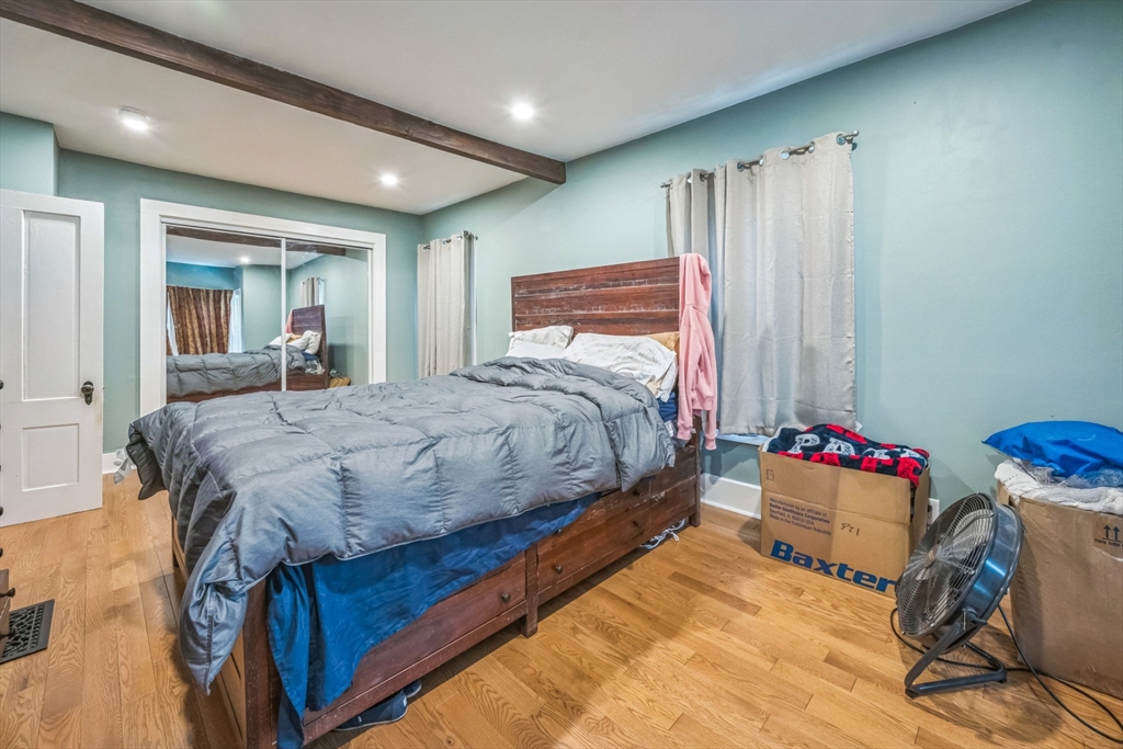 67 Meadow Street Framingham, MA 01701 - Photo 8 of 15 a bedroom with a bed and a window