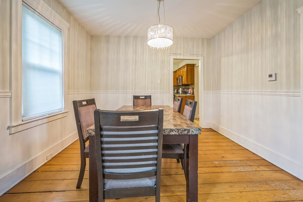 67 Meadow Street Framingham, MA 01701 - Photo 9 of 15 a view of a dining room with furniture and wooden floor
