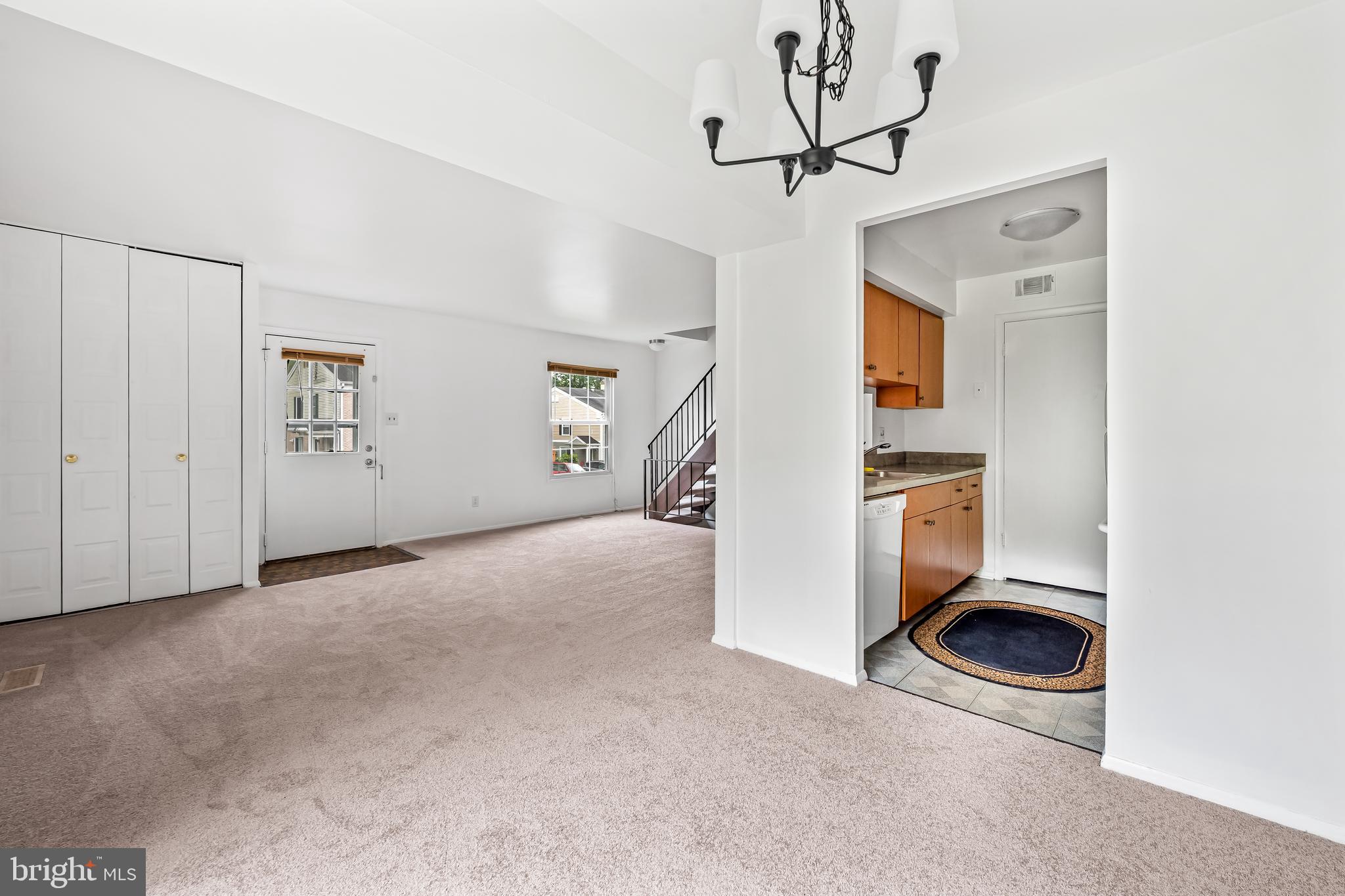 26 Mission Wood Way, Unit A Reisterstown, MD 21136 - Photo 11 of 29 a view of a hallway with a washer and dryer