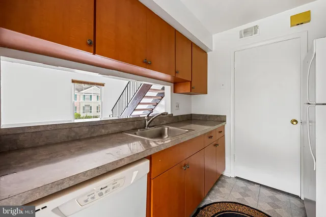 a kitchen with a stove and a sink