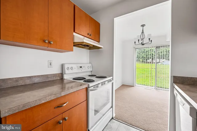 a kitchen with a sink and a window