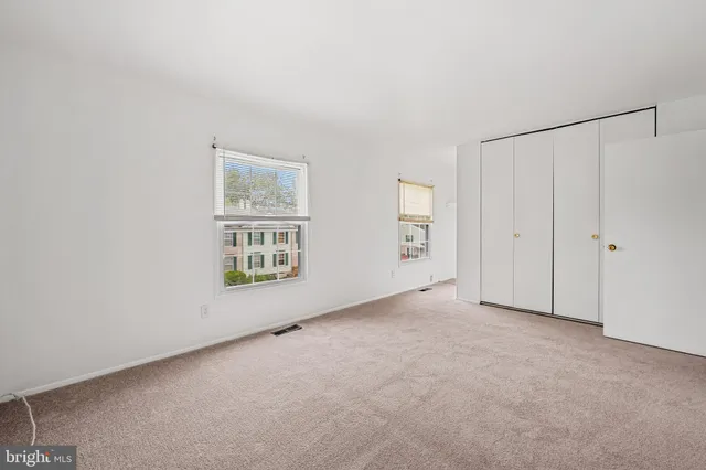 an empty room with windows