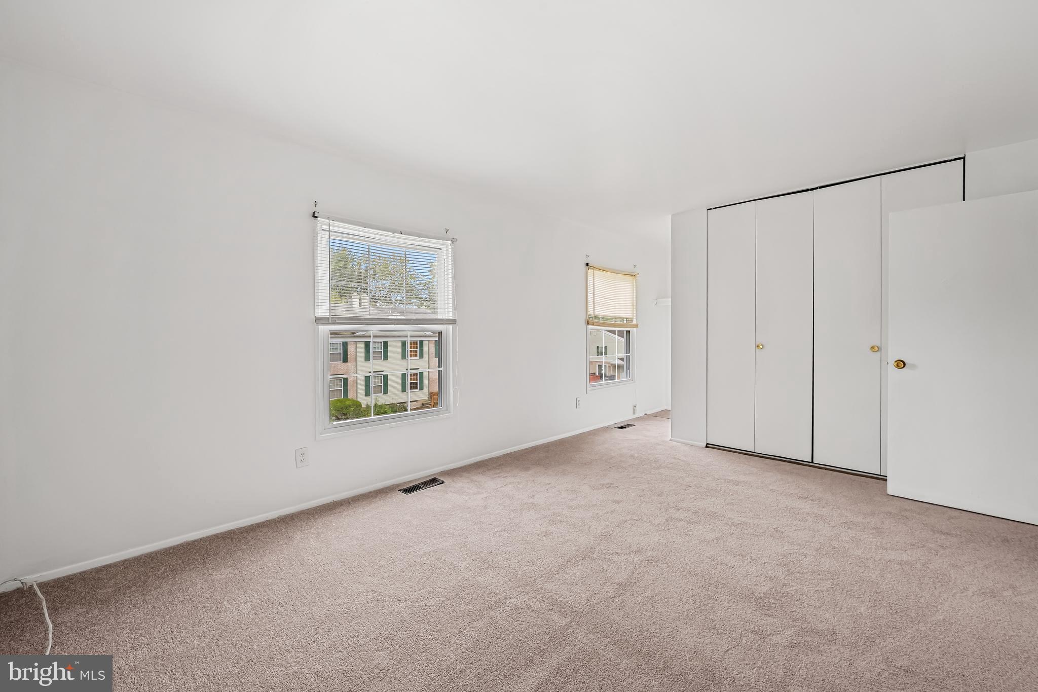 26 Mission Wood Way, Unit A Reisterstown, MD 21136 - Photo 19 of 29 a view of an empty room with a window