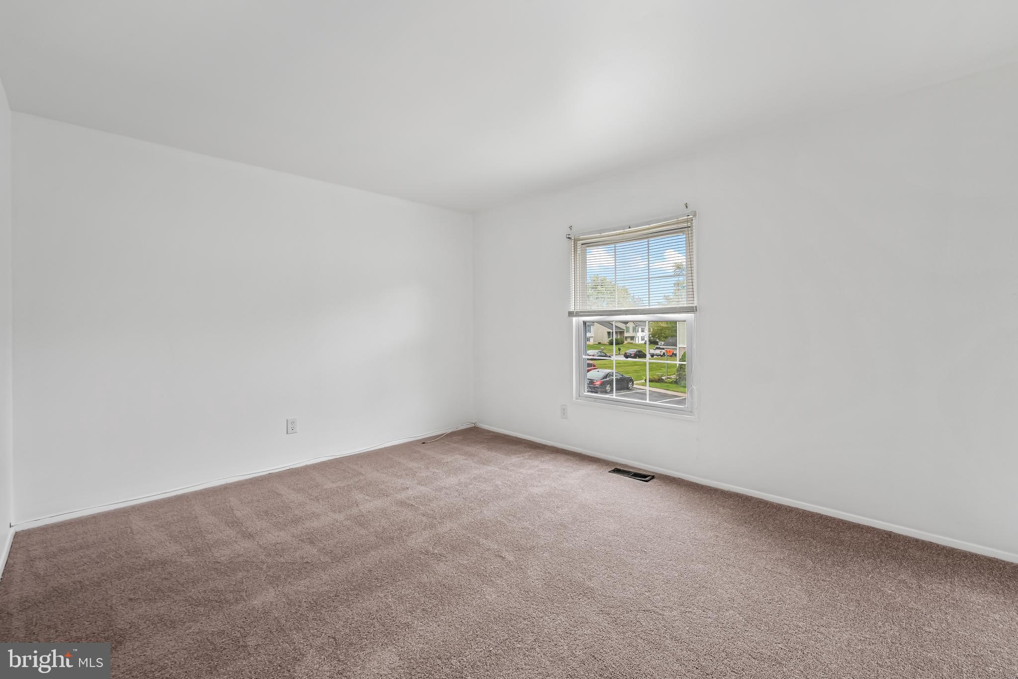 26 Mission Wood Way, Unit A Reisterstown, MD 21136 - Photo 20 of 29 an empty room with windows