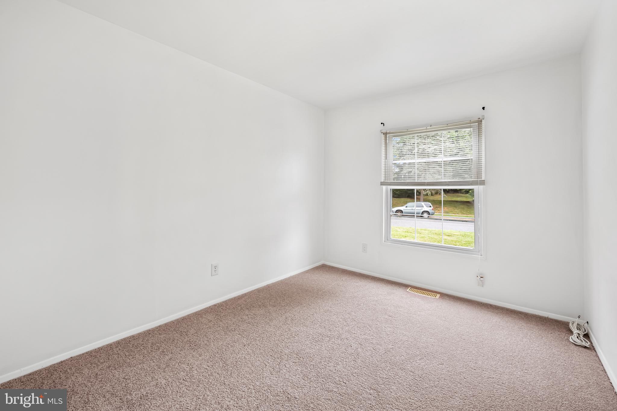 26 Mission Wood Way, Unit A Reisterstown, MD 21136 - Photo 21 of 29 an empty room with windows