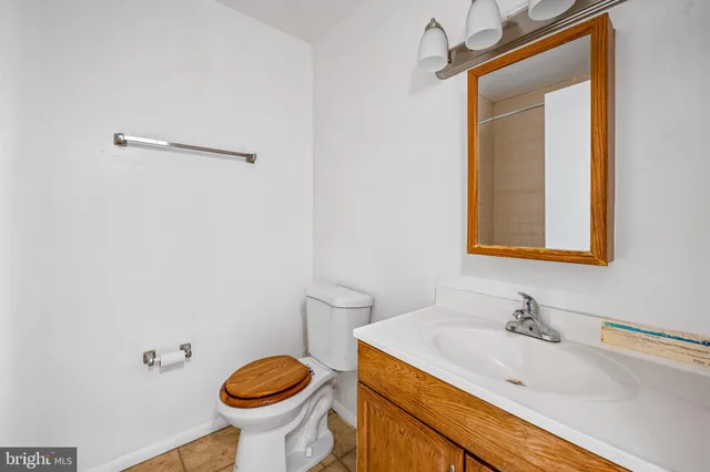 a bath tub sitting next to a white sink
