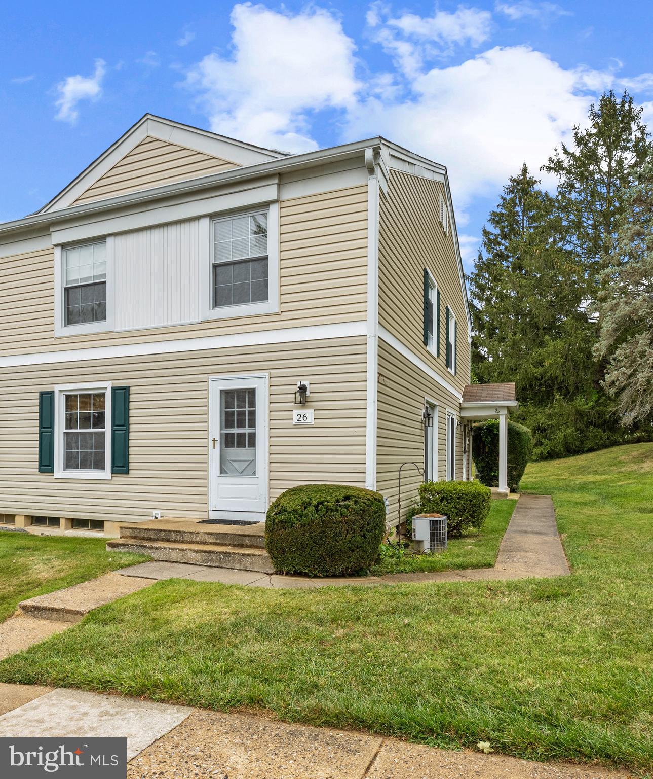 26 Mission Wood Way, Unit A Reisterstown, MD 21136 - Photo 3 of 29 a front view of a house with a yard