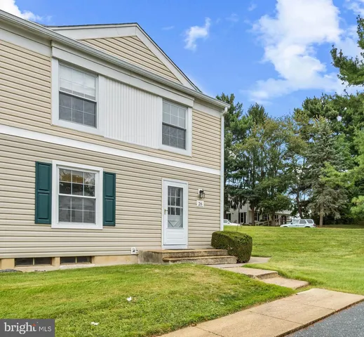 a house that has a big yard in front of it
