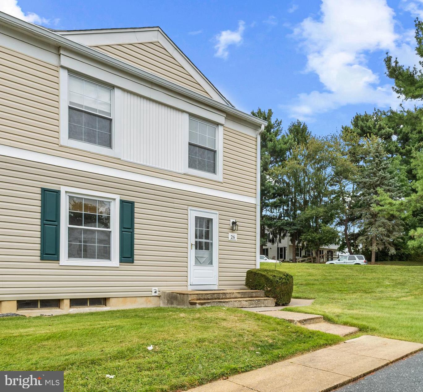 26 Mission Wood Way, Unit A Reisterstown, MD 21136 - Photo 4 of 29 a house that has a big yard in front of it