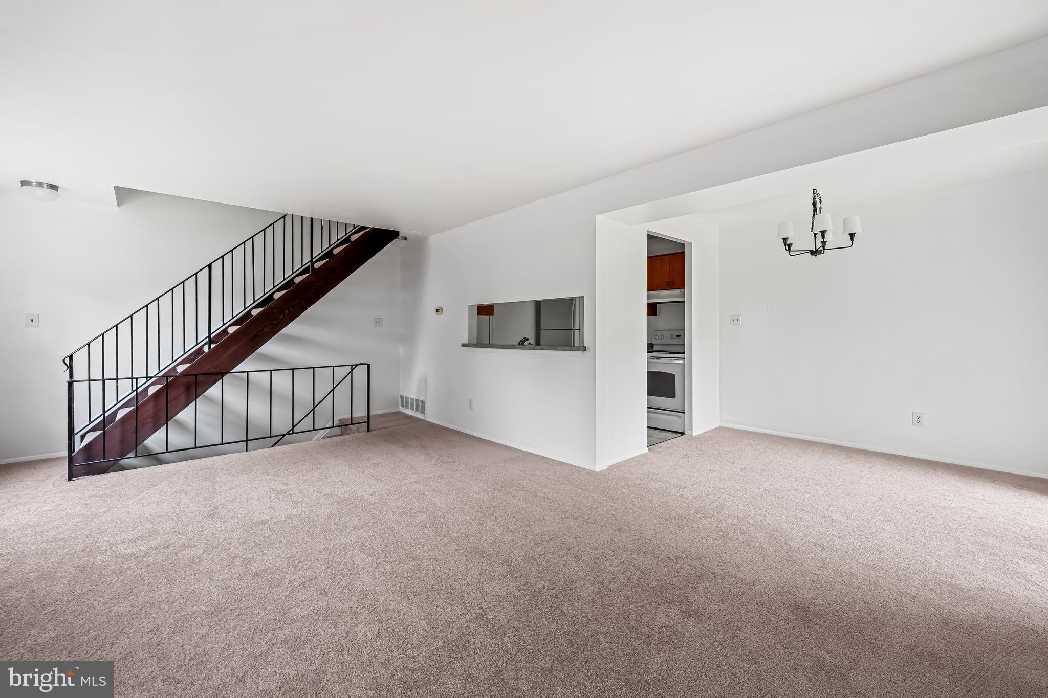 26 Mission Wood Way, Unit A Reisterstown, MD 21136 - Photo 8 of 29 a view of a livingroom with a staircase