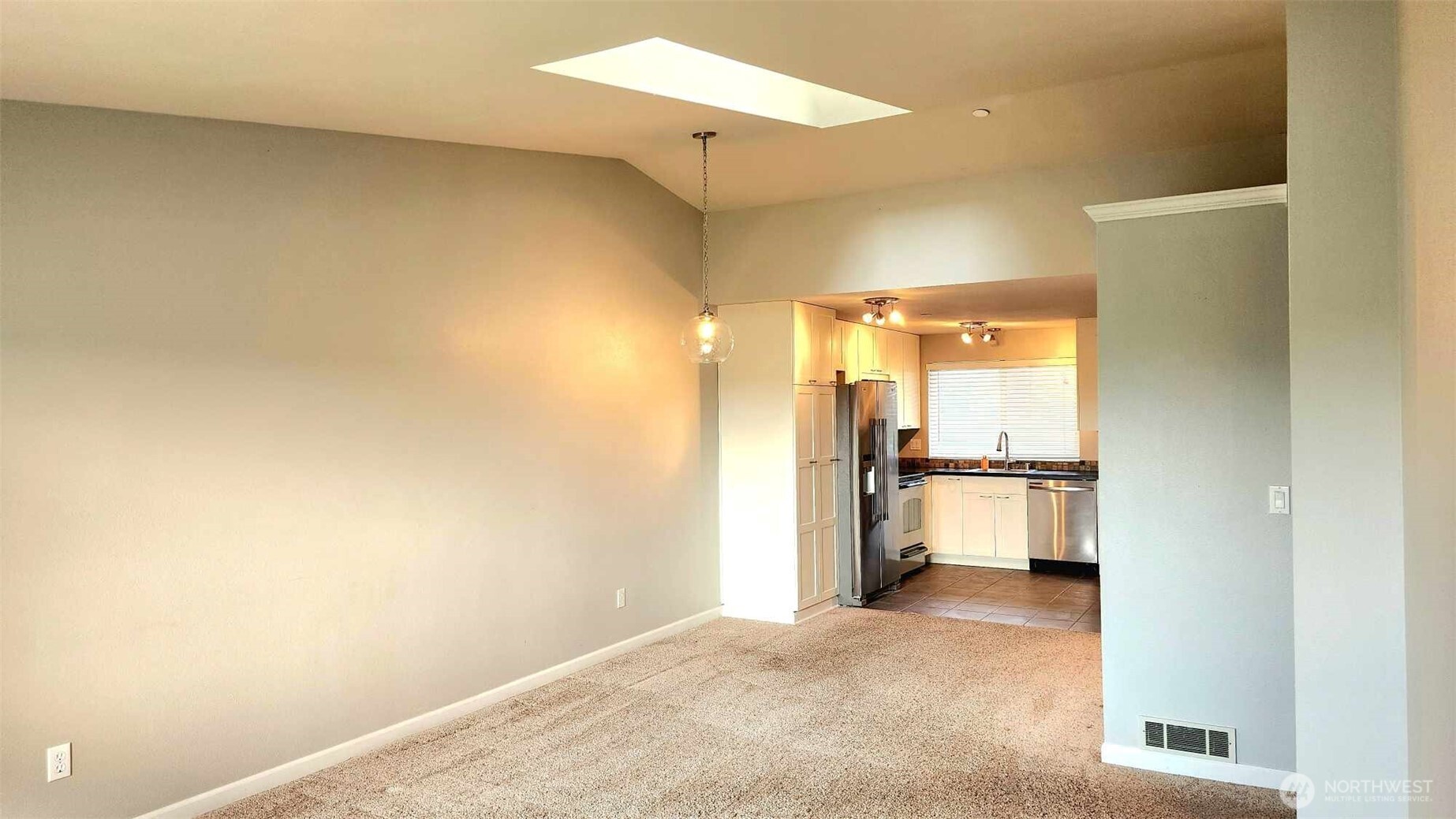 485 Southwest Bayshore Drive, Unit C301 Oak Harbor, WA 98277 - Photo 23 of 40 a view of a room with a refrigerator and a window