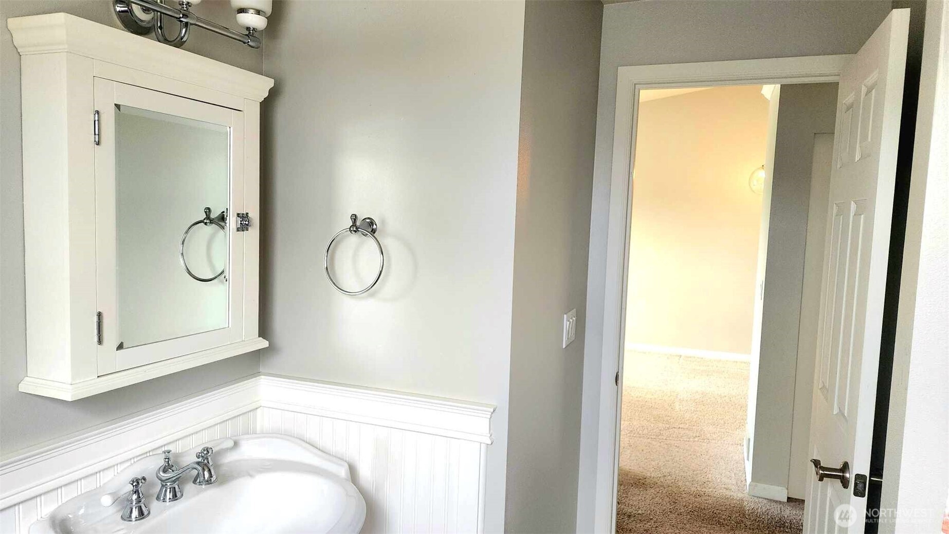 485 Southwest Bayshore Drive, Unit C301 Oak Harbor, WA 98277 - Photo 31 of 40 a bathroom with a granite countertop sink mirror and vanity