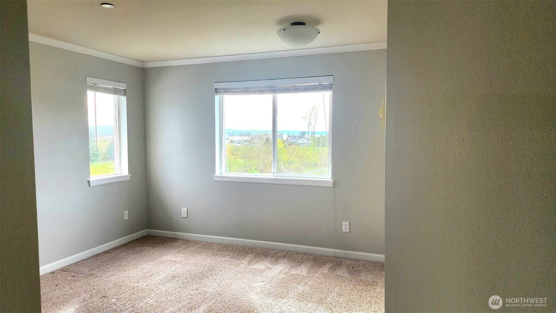 485 Southwest Bayshore Drive, Unit C301 Oak Harbor, WA 98277 - Photo 33 of 40 an empty room with windows