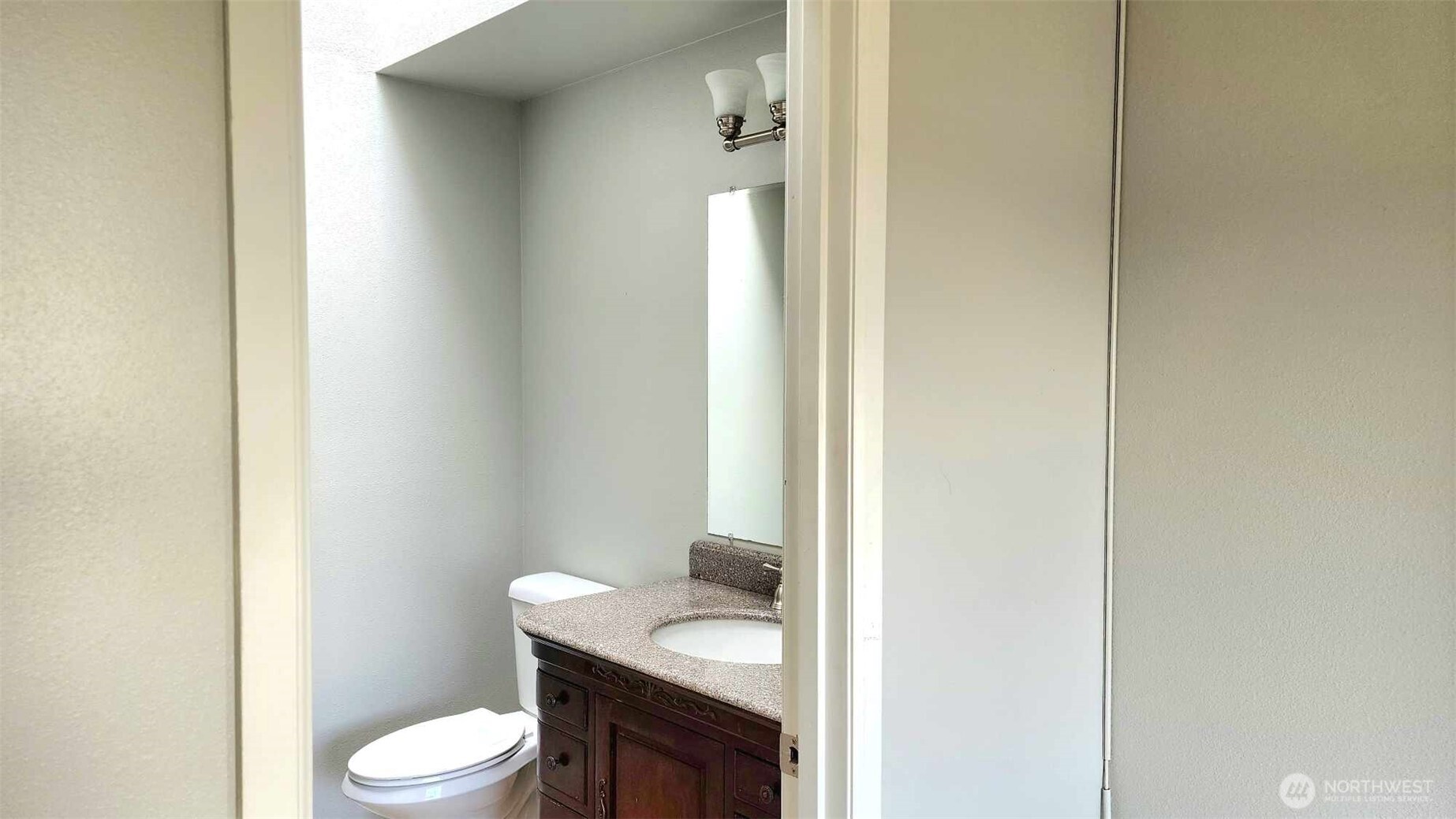 485 Southwest Bayshore Drive, Unit C301 Oak Harbor, WA 98277 - Photo 37 of 40 a white toilet sitting next to a bathroom sink