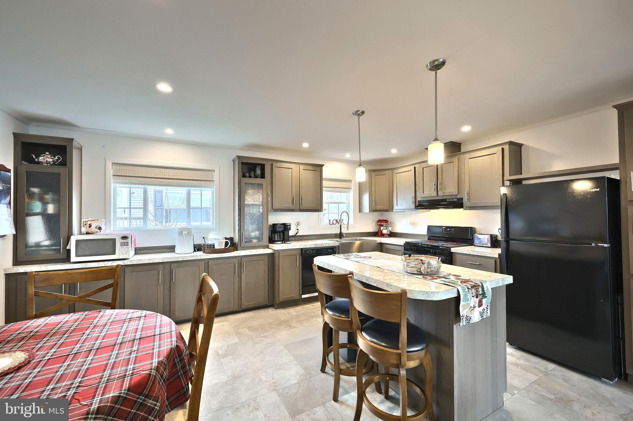 233 Eagle Drive Hanover, PA 17331 - Photo 13 of 26 a kitchen with a table chairs stove and refrigerator