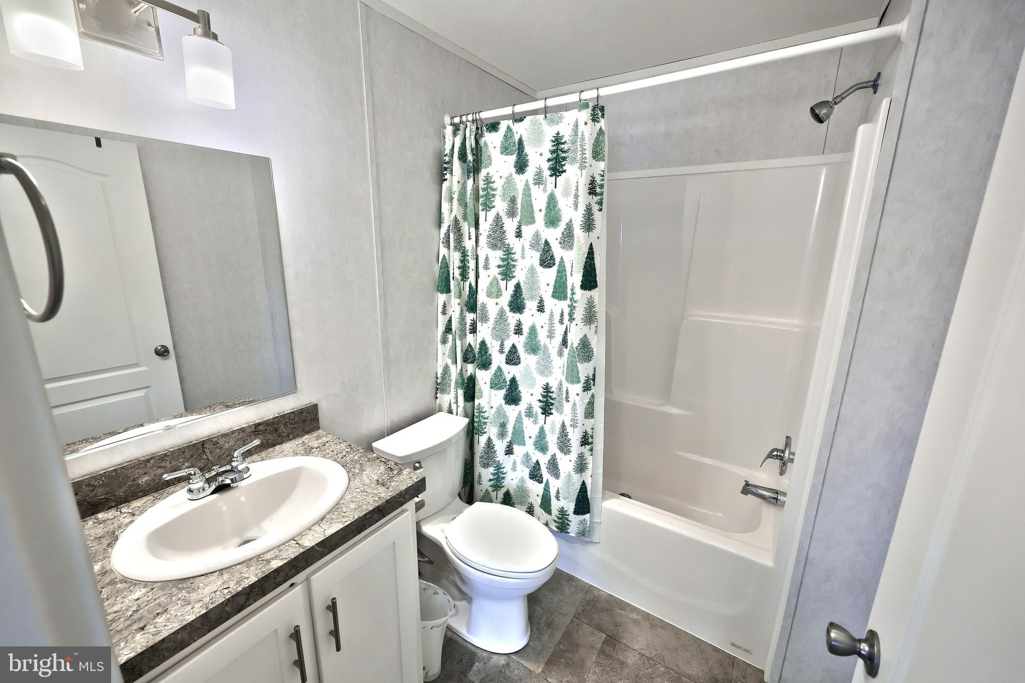 233 Eagle Drive Hanover, PA 17331 - Photo 24 of 26 a bathroom with a granite countertop sink toilet and shower