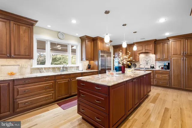 a view of a dining room and hall with furniture