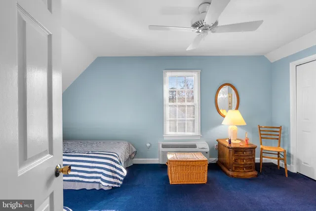a front view of a house with a yard table and chairs